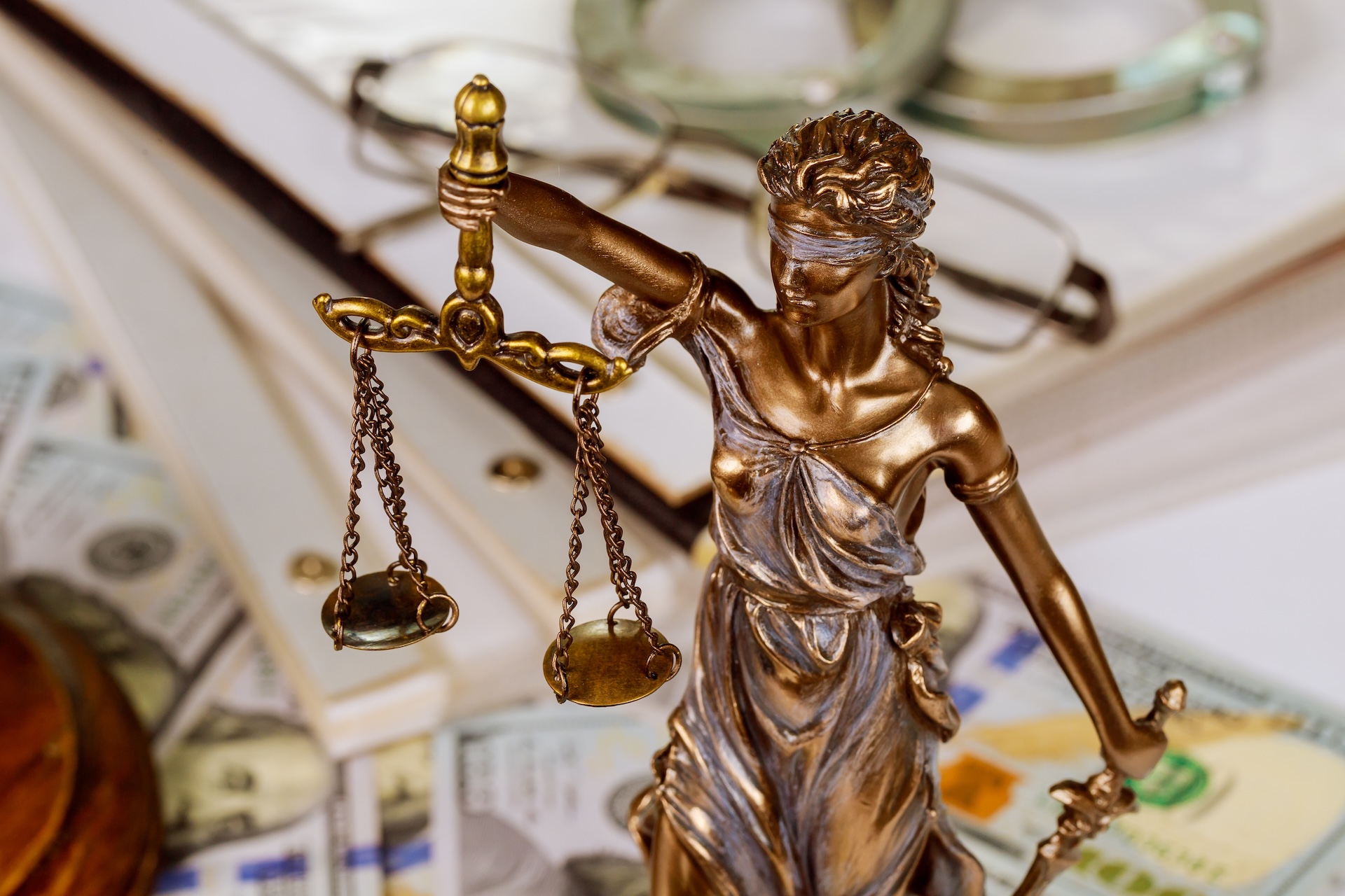 statue of the lady of justice scales with a file f 2025 03 27 06 09 41 utc